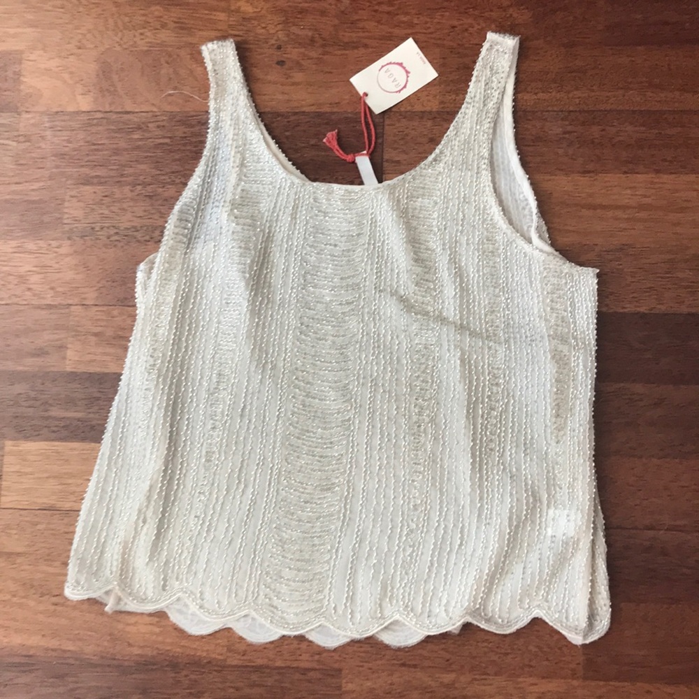NWT beaded tank.  Fits like a small.